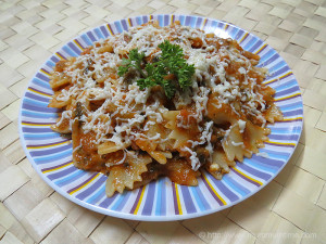 Farfalle (bow-tie pasta) in basil, parsley, and tomato sauce