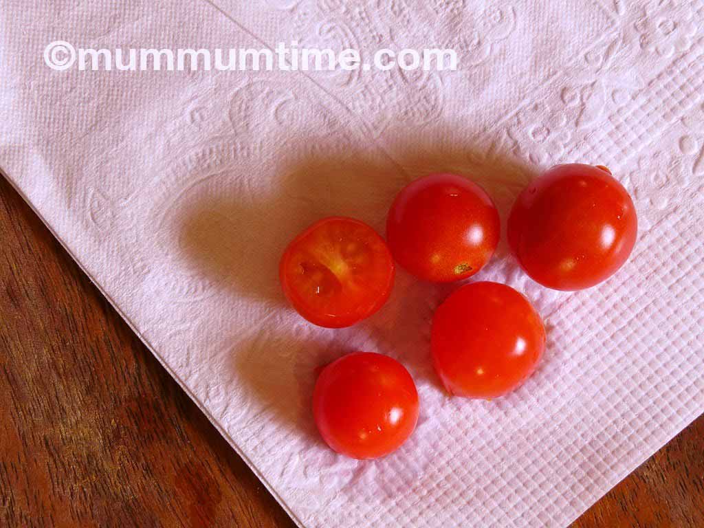 Tomatoes face down on a paper tissue